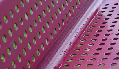 Fototapete - perforated angled metal construction in perspective pink