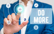 © A - Word writing text Do More. Business photo showcasing act of being productive or creative with less money or resources