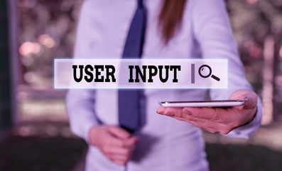 Poster - Writing note showing User Input. Business concept for Any information or data that is sent to a computer for processing Business woman in shirt holding laptop and mobile phone