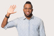 © fizkes - Head shot portrait African American man showing high five gesture