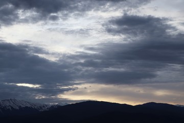 Beautiful morning sky with clouds over the Caucasus mountains in Russia