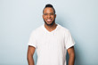 © fizkes - Smiling happy African American man in glasses looking at camera
