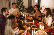 © Drobot Dean - Photo of caucasian excited people having Christmas dinner with turkey