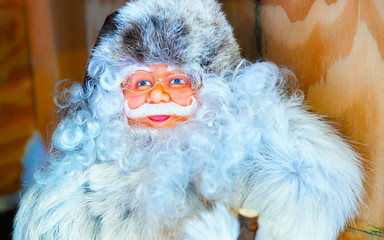 Poster - Winter Saami Souvenirs at Finnish Christmas Market in Rovaniemi, Finland, Lapland. Stall with traditional Santa Claus. Street Xmas holiday fair. Advent and Stalls with Crafts on Bazaar