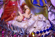 Statuette Of Christmas Jesus,closeup Of Little Jesus In Nativity Scene With Lamb