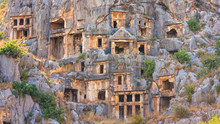 Summer Mediterranean Cityscape - View Of The Ruins Of Ancient Greek Tombs In The Ancient City Of Myra, Near The Turkish Town Of Demre, Antalya Province In Turkey