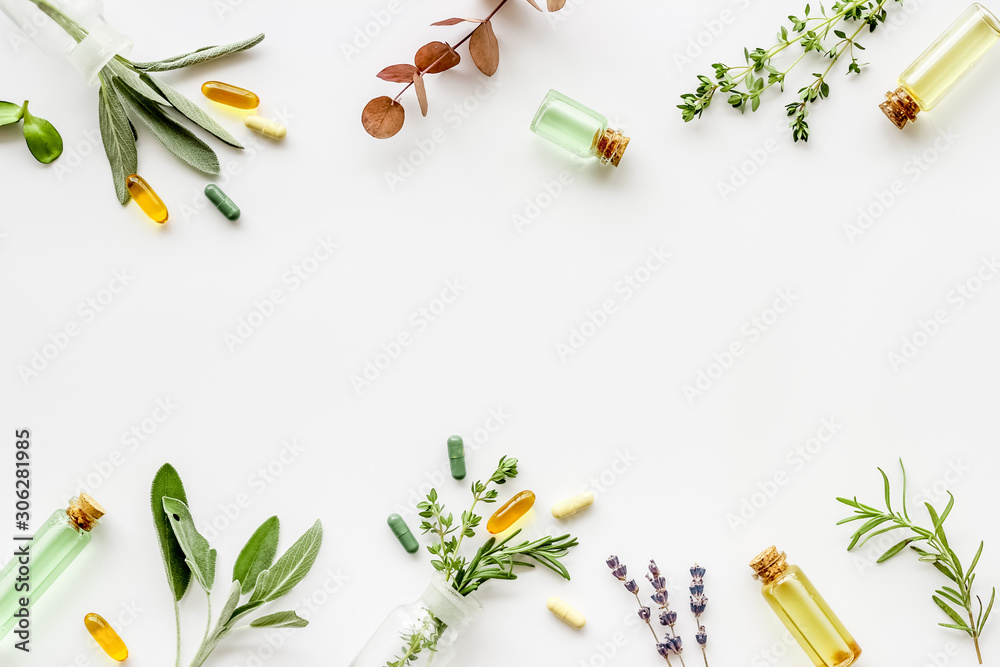 Apothecary of natural wellness and self-care. Herbs and medicine on white background top view frame copy space - obrazy, fototapety, plakaty 