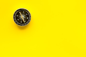 Wall Mural - Compass - small and stylish - on yellow background top view copy space
