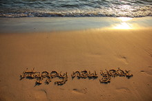 Happy New Year 2020 Is Coming Concept On The Sunset And Tropical Ocean Beach Lettering. 