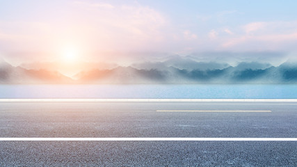 Seaside highway, distant mountain as the background material for the car advertisement.