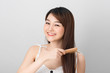 Beautiful girl combs her hair Asian appearance
