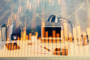 Double exposure of forex graph and work space with computer. Concept of international online trading.