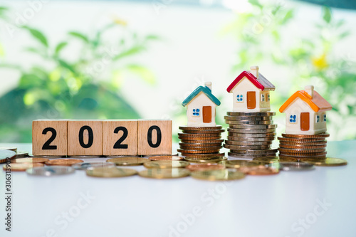 Fotomural Wooden block year 2020 and mini house on stack coins using as business and finan