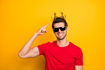 Look i best. Positive cheerful guy enjoy fun prom party event win gold tiara point index finger boast wear red t-shirt isolated over yellow color background