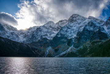 Beautiful view of lake with high mountains with rising sun with backgroun top