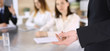 © Iryna - Business presentation. Businessman giving speech to colleagues and partners at corporate meeting or conference, close-up of speaker hands