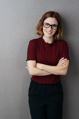 Wall Mural - Friendly young woman wearing spectacles