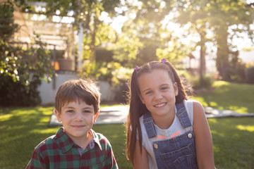 Wall Mural - Siblings outside together in summer