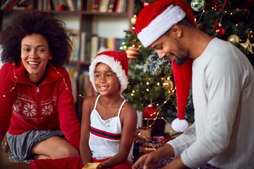 Sticker - Family  with  little daughter playing together for the Christmas holidays