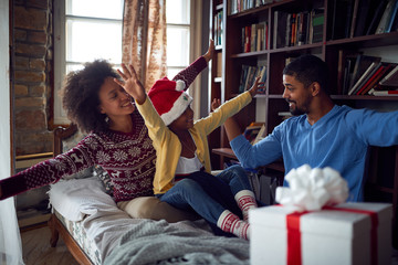 Wall Mural - Family enjoying on winter holiday.happy family celebrate Christmas