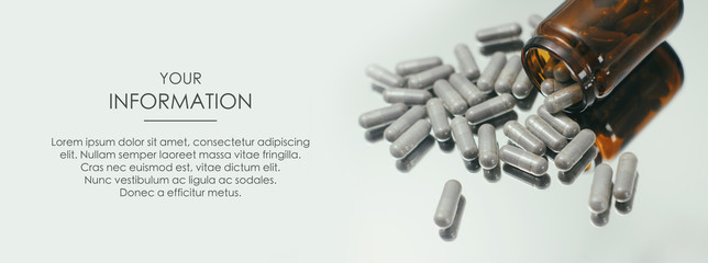 Wall Mural - Pills spilled out of a glass jar. Medical conception. First Aid Kit. Web article template. Long header banner format. Sale coupon. Visit card. Your information. Text space.