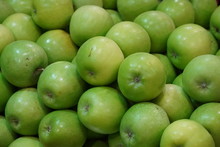 Bunch Of Green Apples On Boxes In Supermarket. Apple Put On Sale Shelves In The Supermarket. Fresh Ripe Apples Displayed Beautifully.