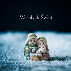 nativity scene and text merry christmas in polish