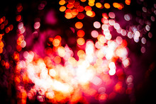 Golden Bokeh Mixed With Diffused Red Light From The Winter Christmas Tree In Thailand. Business Theoretical Concepts For Background Use.