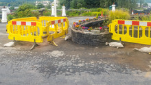 Windermere Burst Water Mains. Flooded Area Surrounded With Yellow Fence After A Pipe Burst In The Lake District, UK.