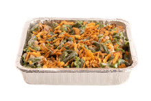 Pan Of Traditional Green Bean Casserole With Fried Onions Isolated On A White Background