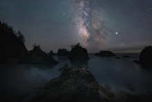 Silhouette Of Sea Stacks Under The Starry Night Sky From Secret Beach