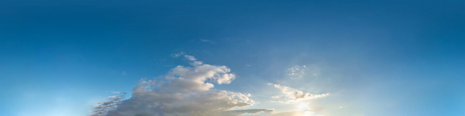 Wall Mural - beautiful clouds in blue sky with evening sun. Seamless hdri panorama 360 degrees angle view  with zenith for use in 3d graphics or game development as sky dome or edit drone shot