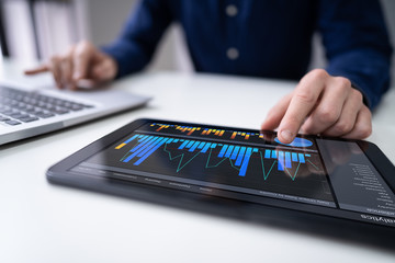 Aufkleber - Person's Hand Pointing On Graph At Tablet