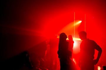 Hands of people silhouette at Night club party