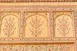 A floral design on the wall of the Ganesh Pol at Amber Fort in Rajasthan, India.