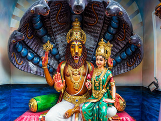 Wall Mural - Colourful statues of Hindu religious deities in Hindu temple in Singapore	