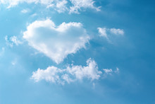 Clouds Heart Shaped Patterns On Bright Blue Sky With Mild Wind And Reflection Light From The Sun For Background