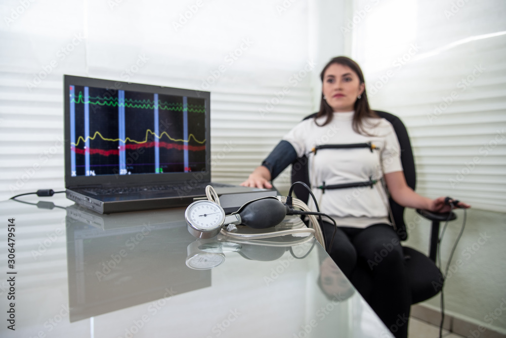 woman in polygraph test with measuring devices to know the truth ...