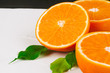 Sliced into pieces juicy ripe oranges close up