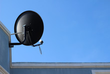 Satellite Dish On The Roof And Blue Sky