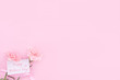 © RomixImage - Beautiful, fresh elegant carnation flower bouquet with white greeting thanks gift card isolated on bright pink color background, top view, flat lay concept.