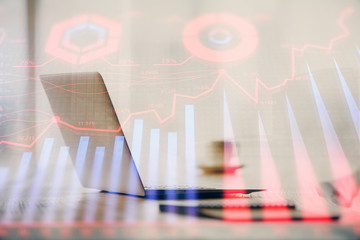 Multi exposure of graph and financial info and work space with computer background. Concept of international online trading.