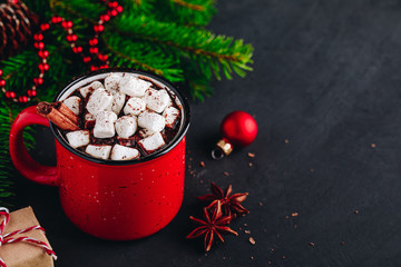 Wall Mural - Christmas winter drink Hot Chocolate with marshmallow and cinnamon stick in red mug