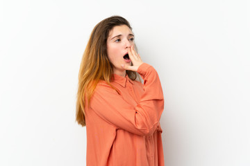 Wall Mural - Young brunette girl over isolated white background yawning and covering wide open mouth with hand