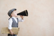 © Sunny studio - Child shouting through vintage megaphone
