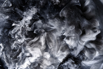 abstract black and white swirling smoke background. cumulus thunderclouds, mysterious and frightenin