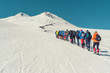 Climbing Elbrus group of climbers goes in the snow to the top
