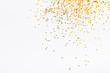 White background with golden glitter. Party background with confetti.