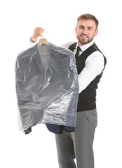 Male worker of modern dry-cleaner's with clothes on white background