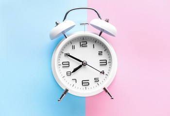 Alarm clock on color background